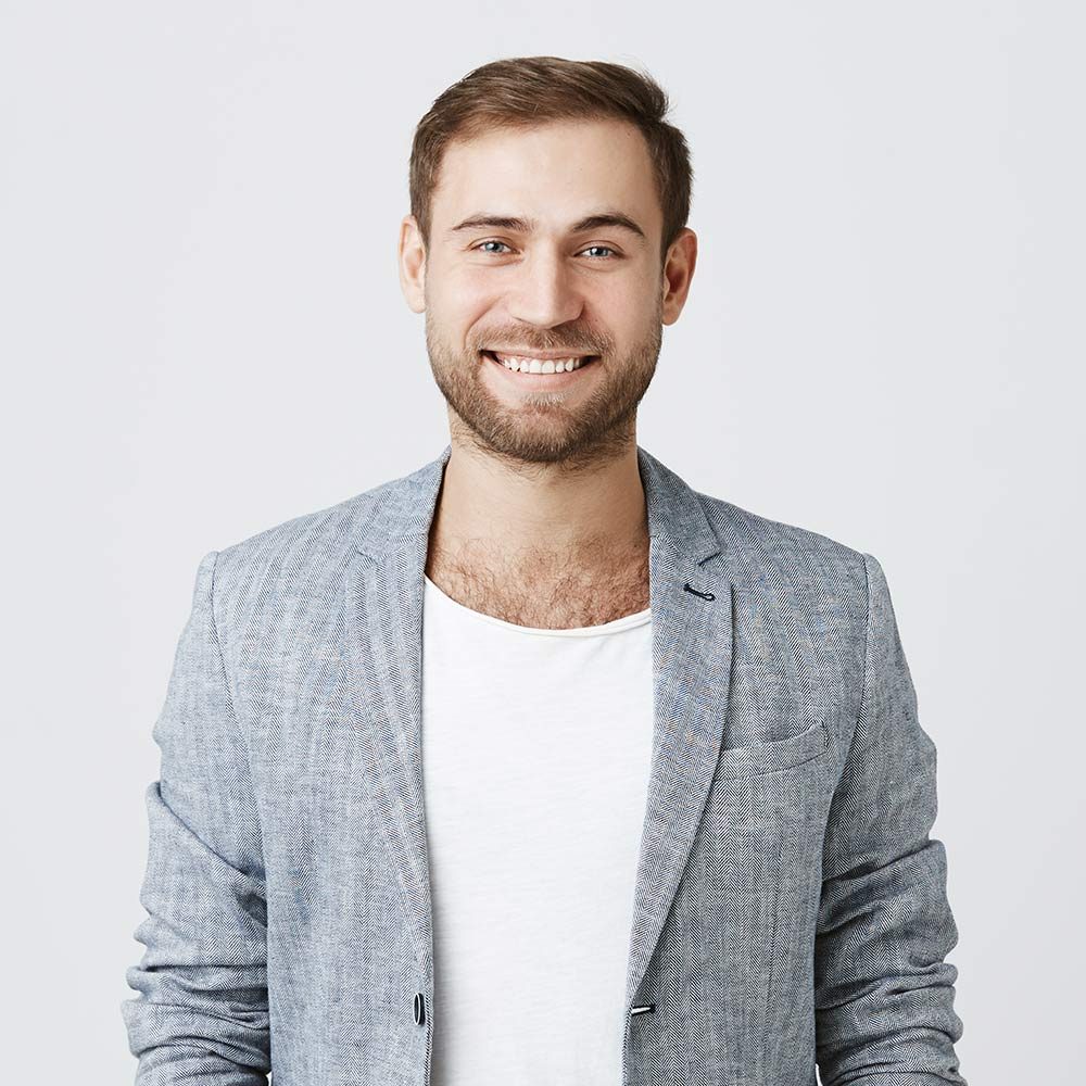 smiling-man-in-jacket-posing-indoors-2026-01-05-05-14-15-utc.jpg
